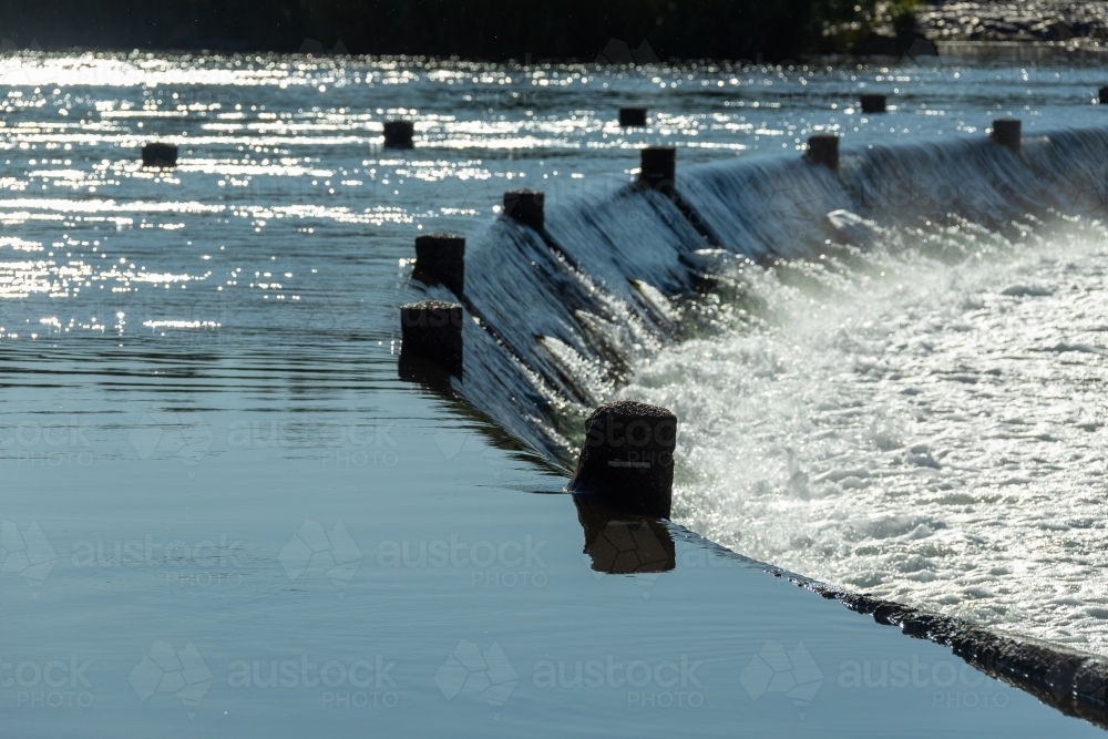 water flowing over the Ivanhoe River Crossing near Kununurra - Australian Stock Image