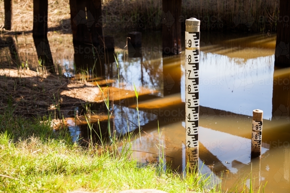 Water level depth indicator in a regional creek crossing - Australian Stock Image