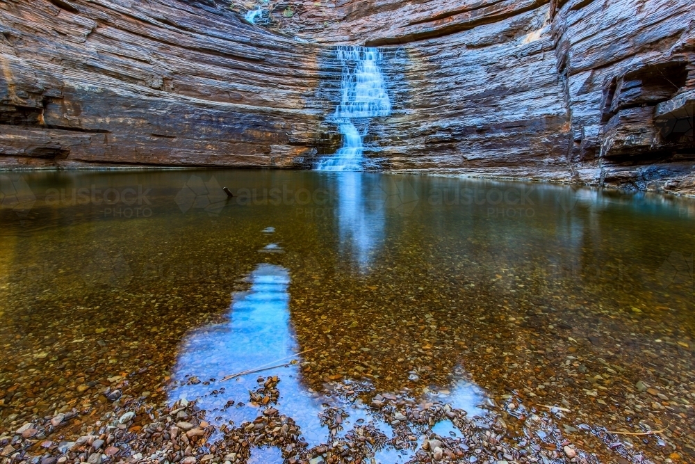 Waterfall and pool at bottom of rocky gorge - Australian Stock Image