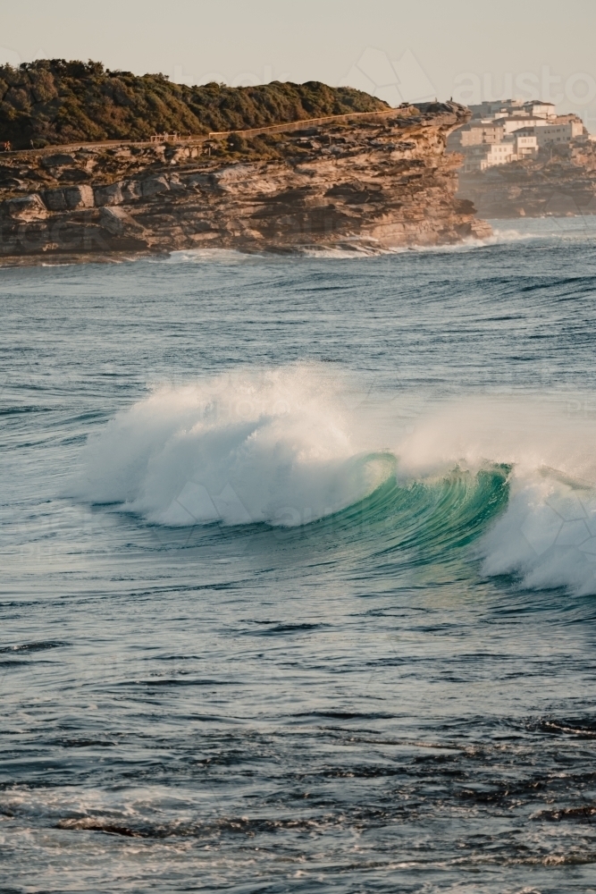 Wave crashing at Bronte Beach at sunrise - Australian Stock Image