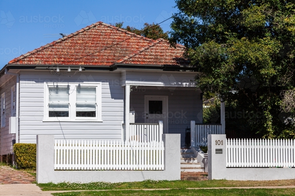 Weatherboard house with steps to porch - Australian Stock Image