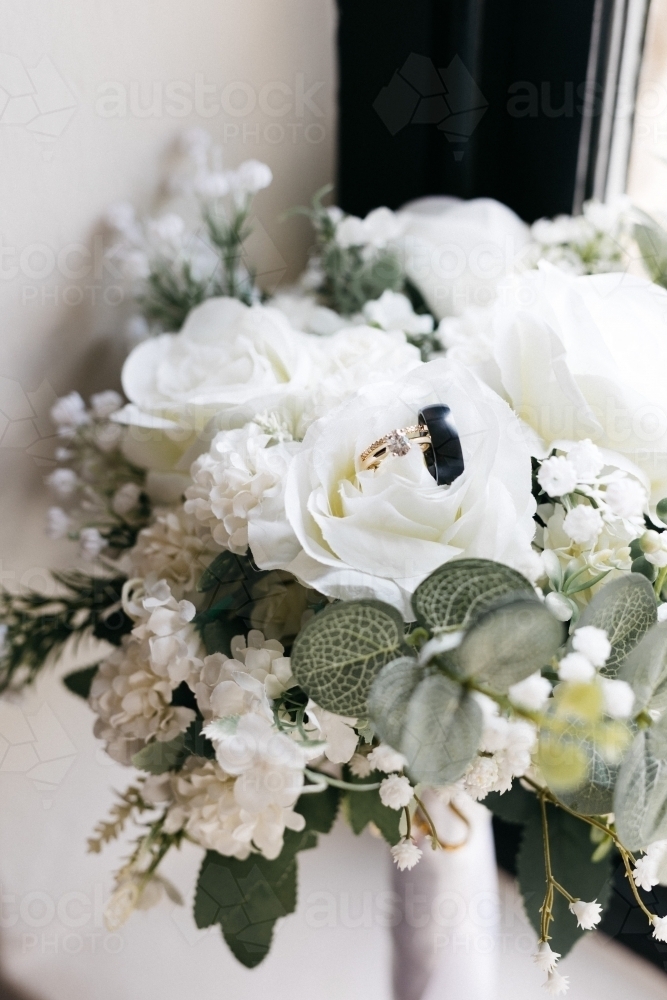 Wedding flowers with wedding rings - Australian Stock Image