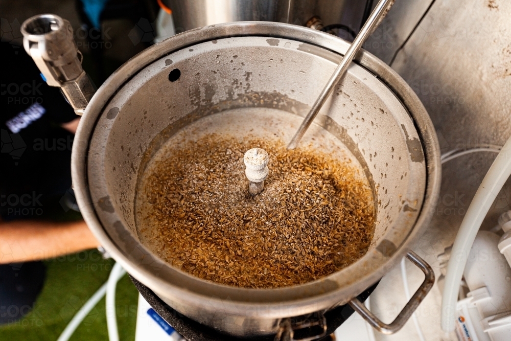 Wheat in beer boiler - Australian Stock Image