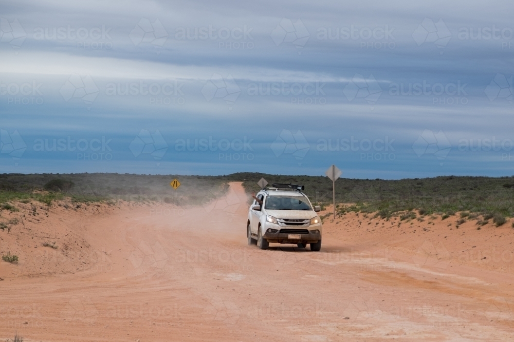 White 4wd driving remote dirt roads - Australian Stock Image