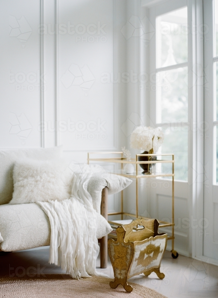 White interior with brass touches for a brightly lit home - Australian Stock Image