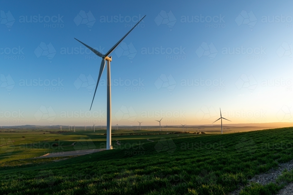 wind turbine with wind farm in background - Australian Stock Image