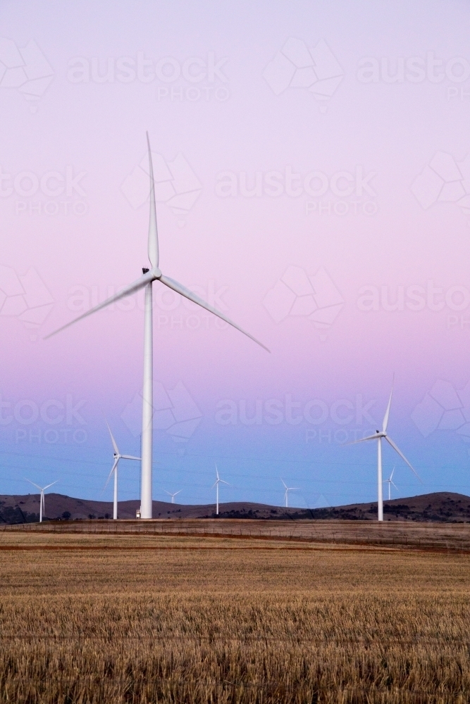 Wind turbines against evening sky - Australian Stock Image