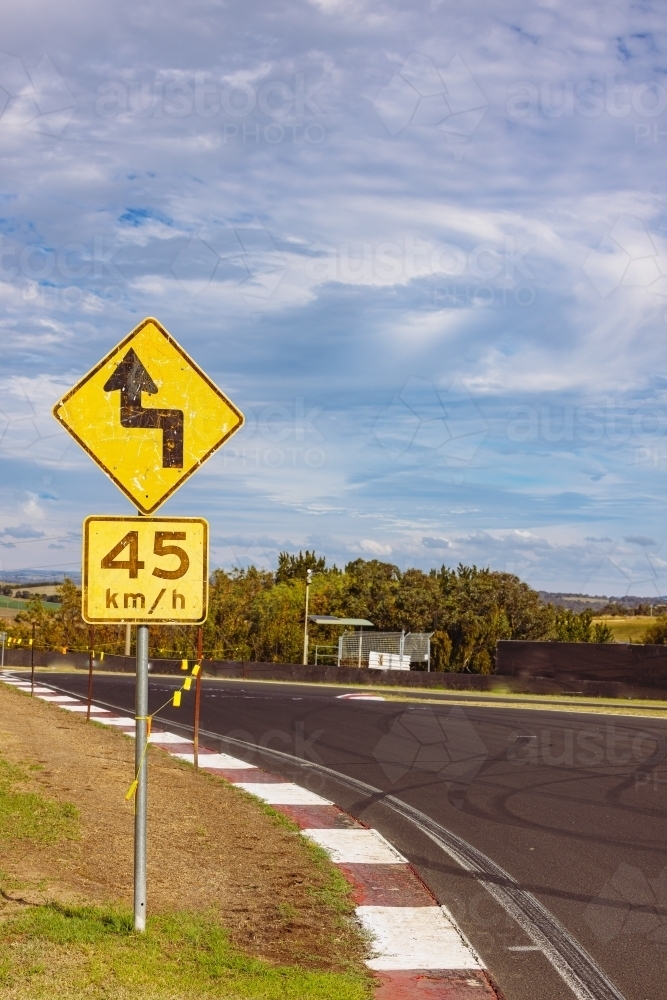 Winding road warning sign on the Mount Panorama racing circuit public road - Australian Stock Image