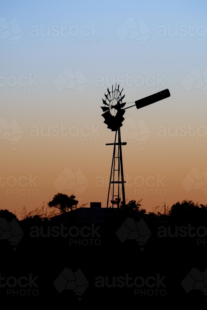 Windmill silhouette at dusk - Australian Stock Image