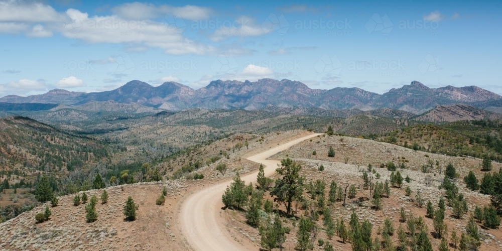 Windy dirt road leading through the Flinders Ranges - Australian Stock Image