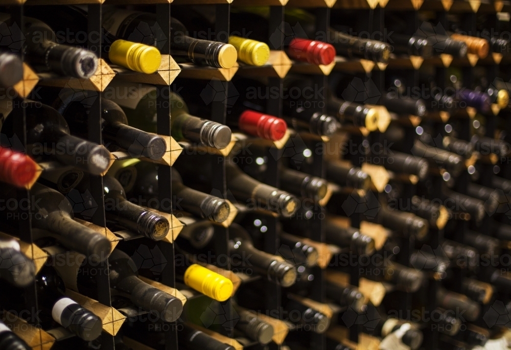 Wine bottles in wine rack - Australian Stock Image
