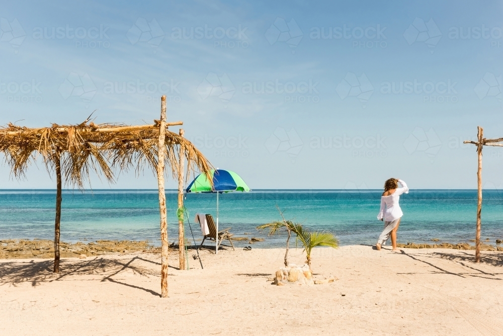 Woman at beach on summertime holiday - Australian Stock Image