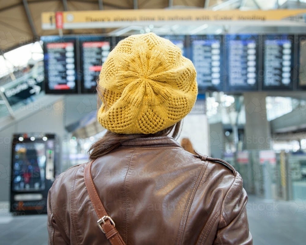 Woman reading the Railway Timetable - Australian Stock Image