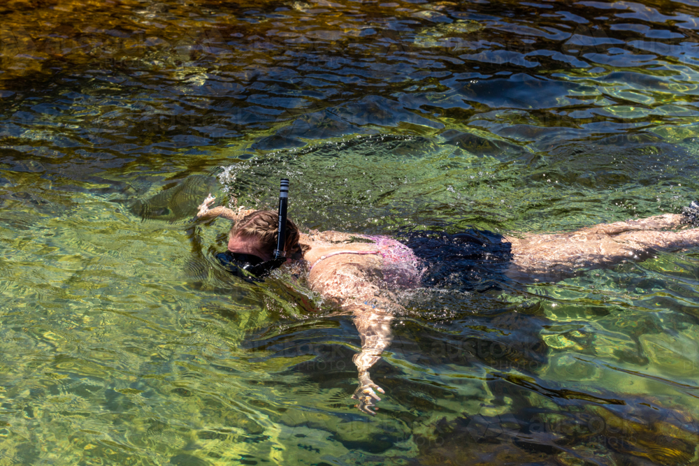 Woman snorkelling in the Australian summer sun - Australian Stock Image