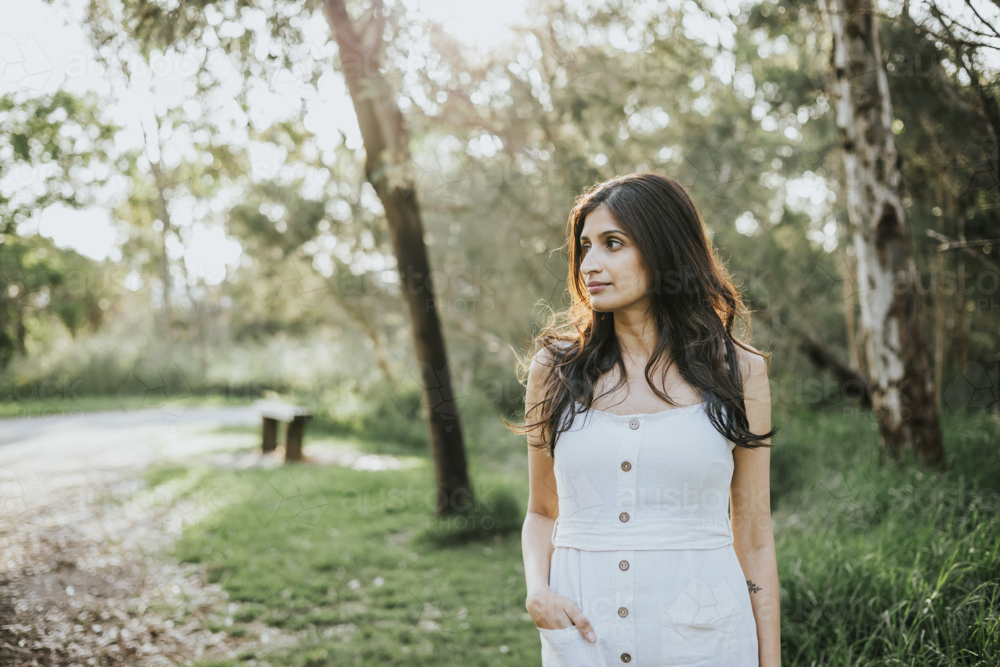 Woman walking at sunset - Australian Stock Image