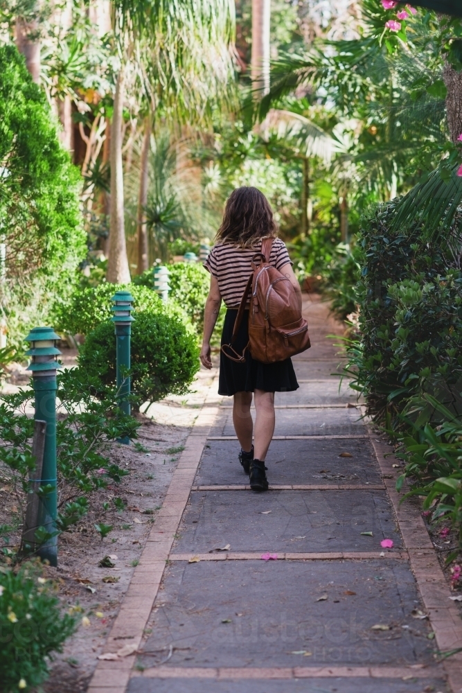 woman walking in garden - Australian Stock Image