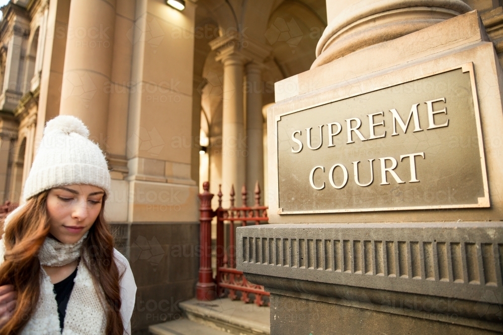 Woman walking Past Supreme Court Melbourne - Australian Stock Image