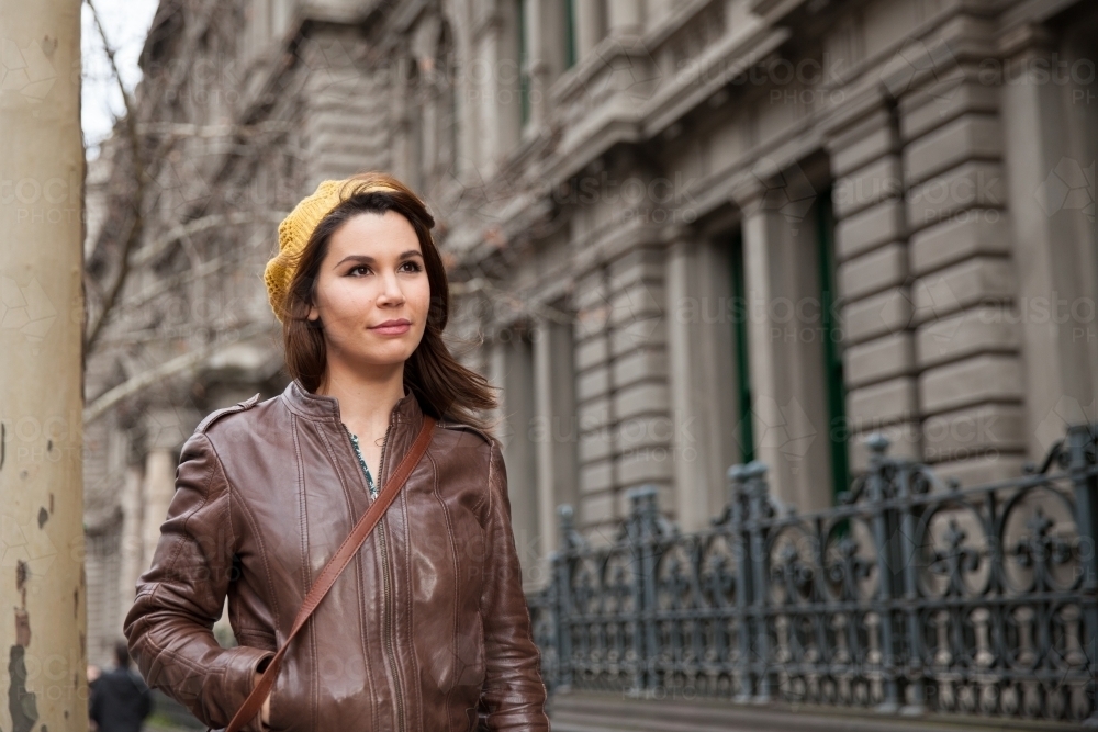 Woman walking through Melbourne in Winter - Australian Stock Image