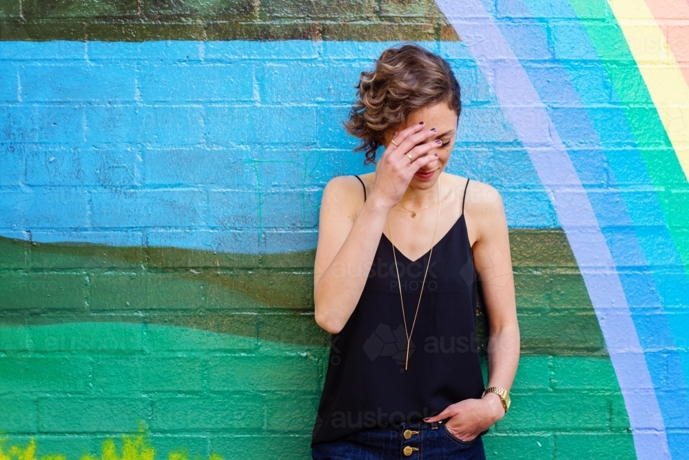 woman with head bowed - Australian Stock Image