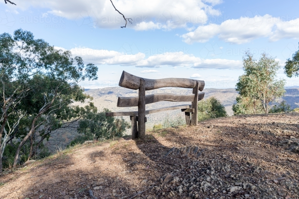 Wooden seat with mountain view - Australian Stock Image