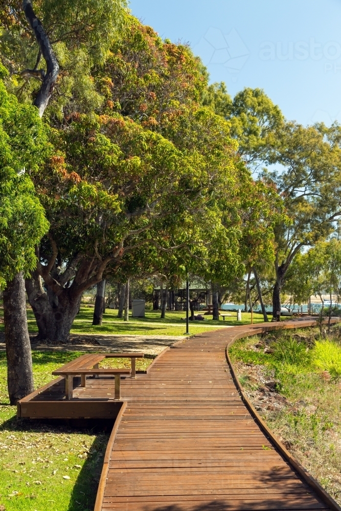 Wooden walking path along the edge of Round Hill Creek, Town of 1770, Queensland. - Australian Stock Image