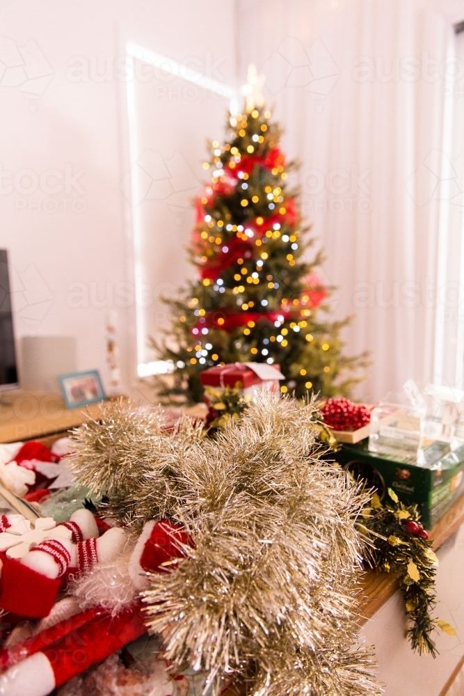 working on decorating the Christmas tree - Australian Stock Image