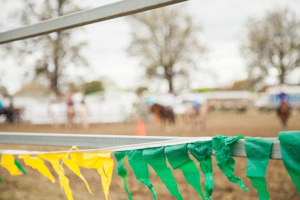 Yellow and green flags along arena fence at the showground - Australian Stock Image