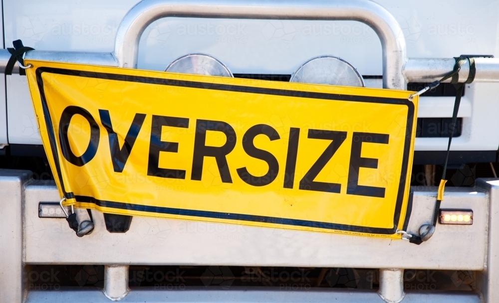 Yellow oversize sign attached to the front on a truck - Australian Stock Image