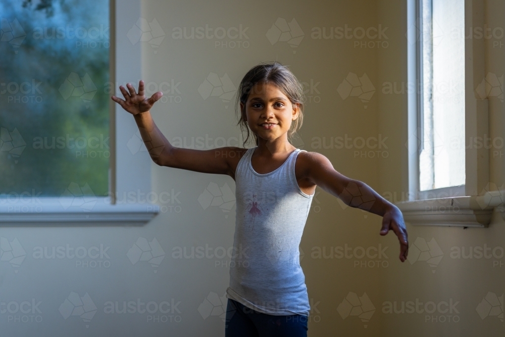 young aboriginal girl making expressive gestures - Australian Stock Image