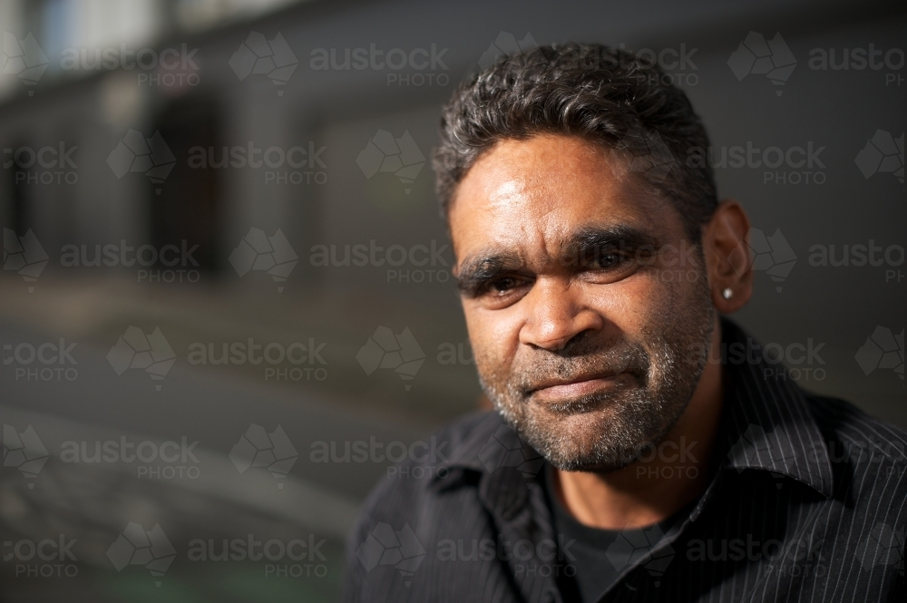Young Aboriginal Man with stubbles smiling - Australian Stock Image