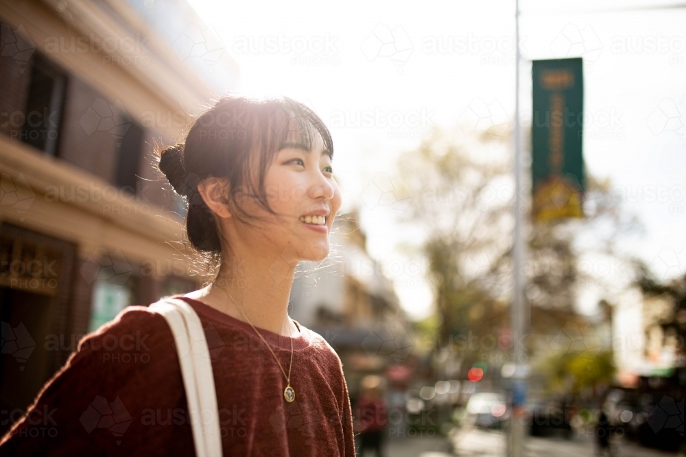 Young adult asian woman exploring the inner west urban streets of Sydney - Australian Stock Image