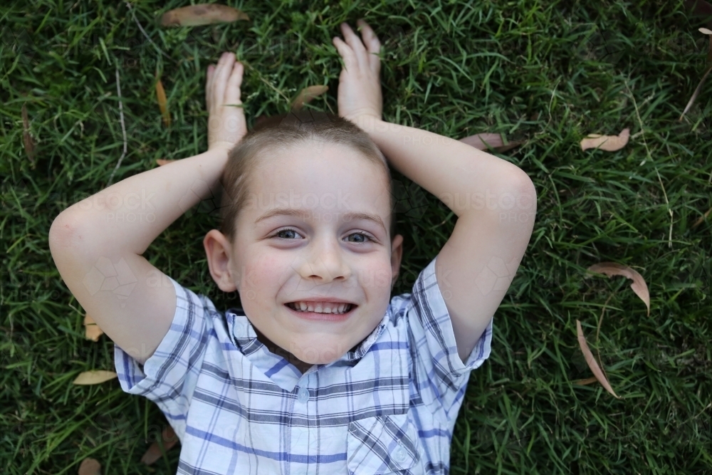 Young boy pretending to be bunny rabbit - Australian Stock Image