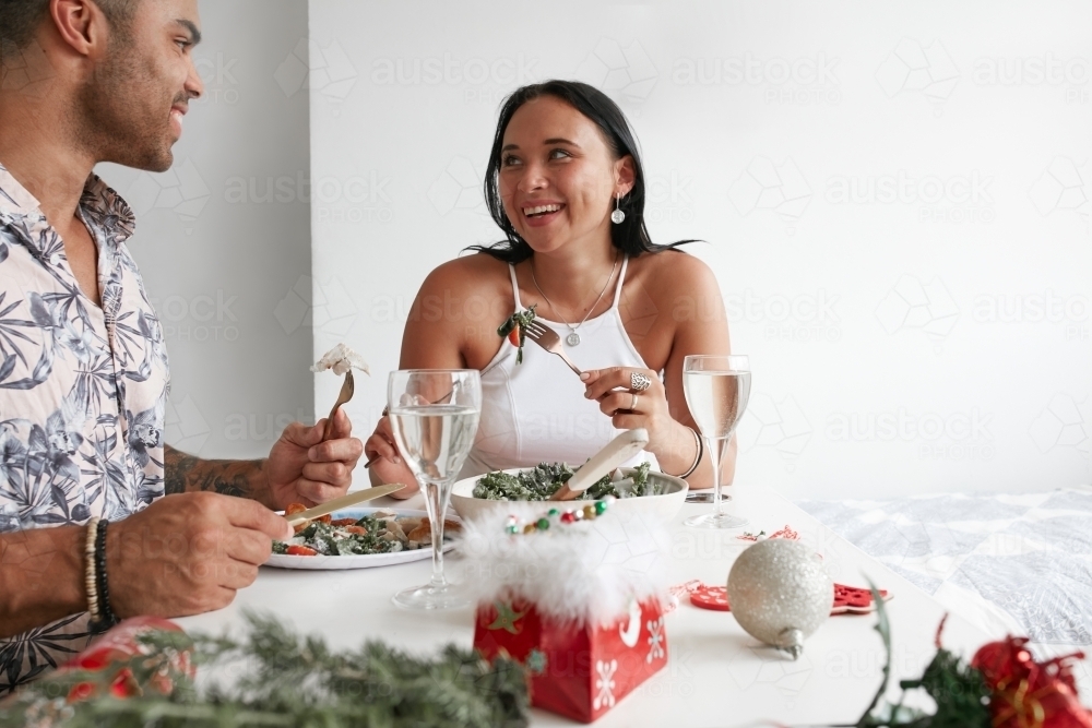 Young couple celebrating Xmas lunch together - Australian Stock Image