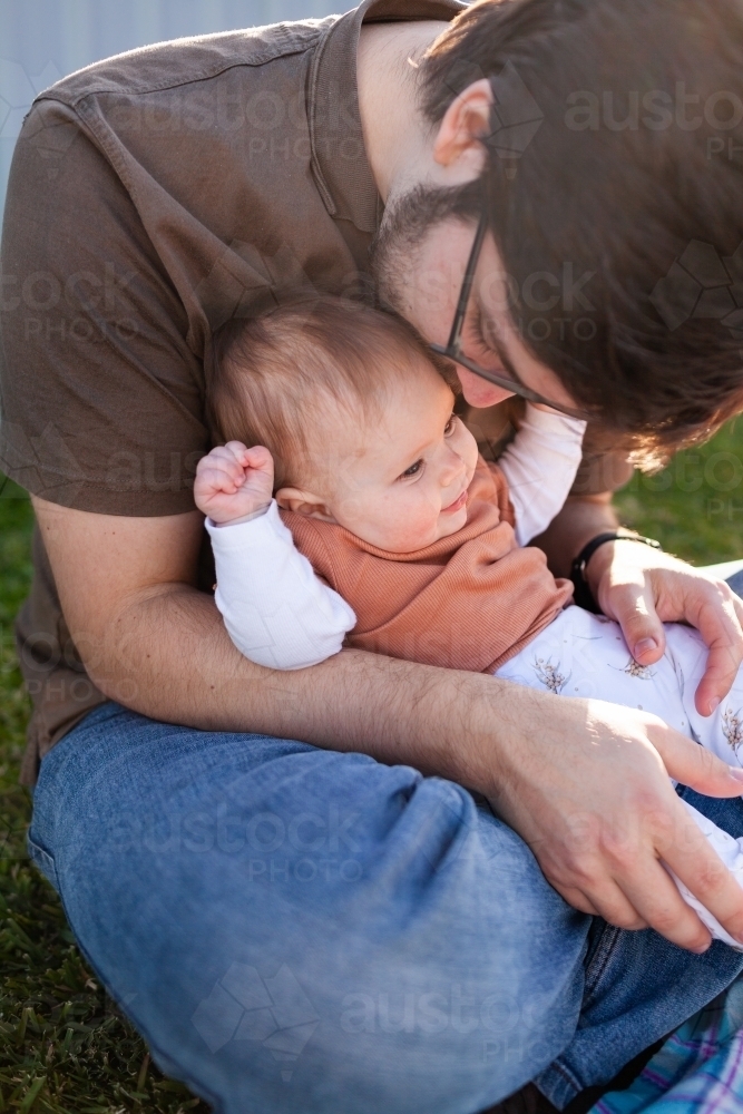 Image Of Young Dad Kissing Daughter On Head Outside Austockphoto