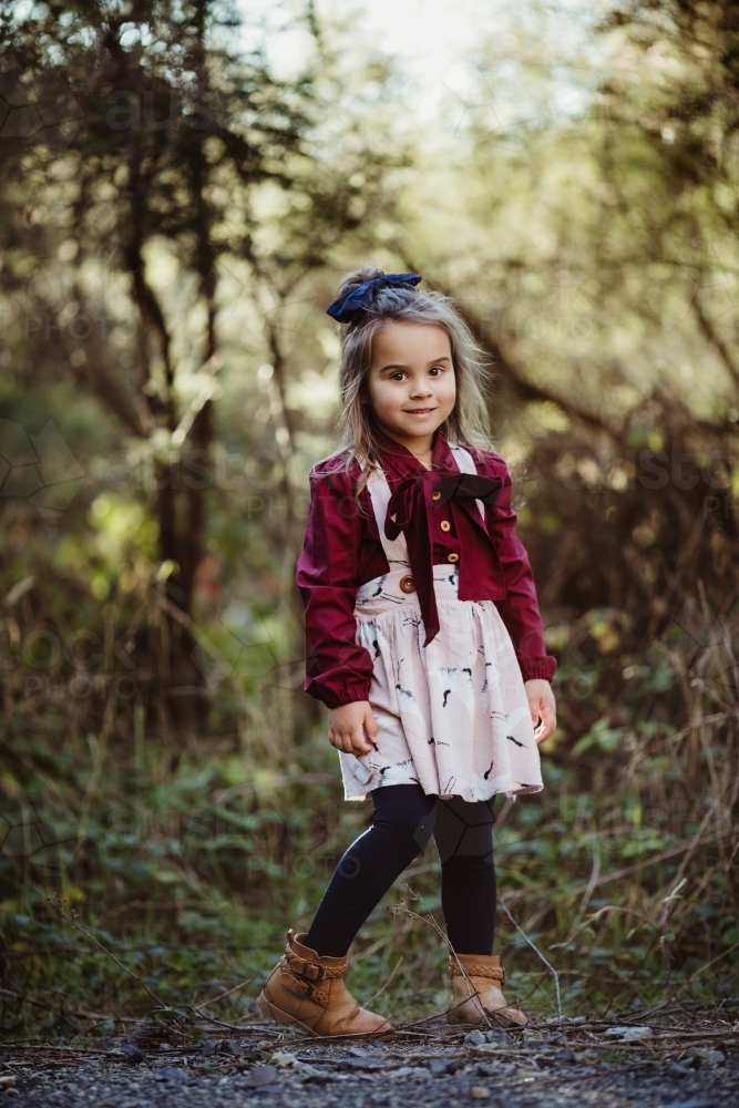 Young fashionable girl standing in bush setting - Australian Stock Image