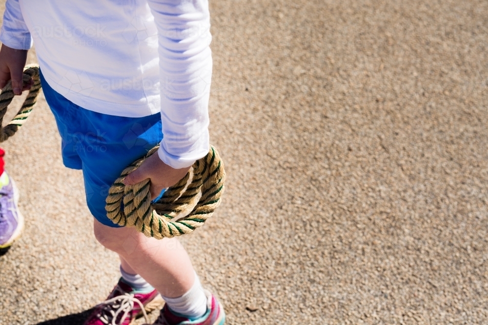 Young girl holding rope quoits - Australian Stock Image