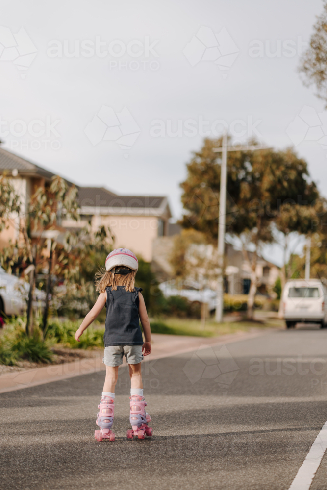 Young girl on her roller blades on the street - Australian Stock Image