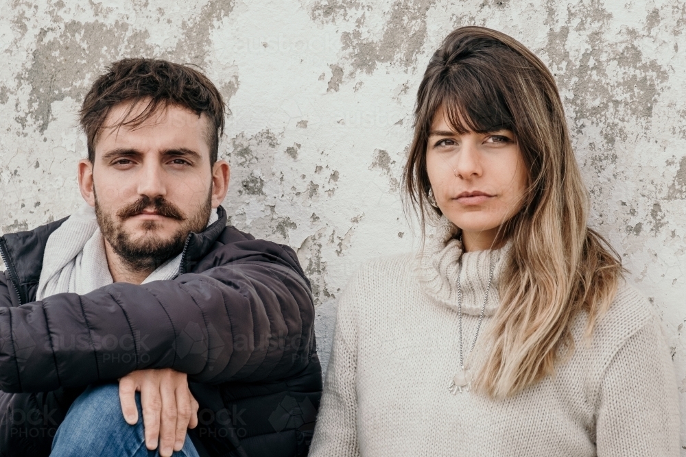 Young hip couple look at the camera. - Australian Stock Image