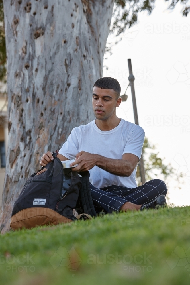 Young Indigenous Australian man enjoying time outdoors - Australian Stock Image