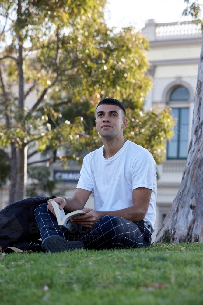 Young Indigenous Australian man enjoying time outdoors - Australian Stock Image