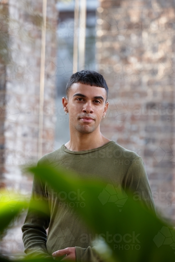 Young Indigenous Australian man enjoying time outdoors - Australian Stock Image