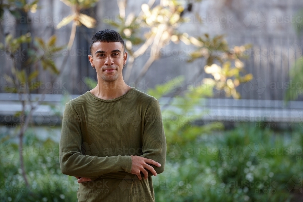 Young Indigenous Australian man enjoying time outdoors - Australian Stock Image