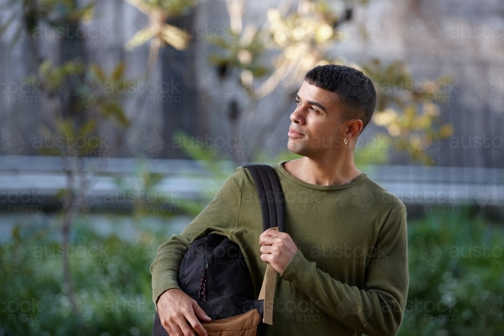 Young Indigenous Australian man enjoying time outdoors - Australian Stock Image