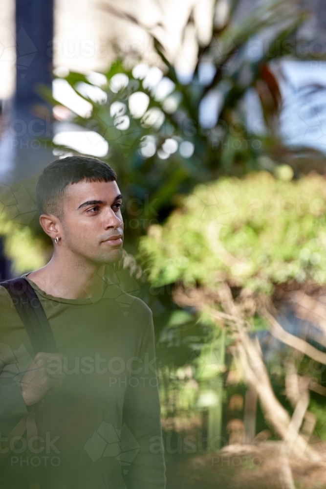 Young Indigenous Australian man enjoying time outdoors - Australian Stock Image