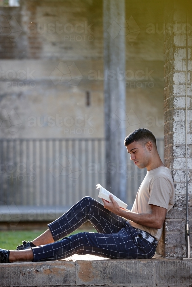 Young Indigenous Australian man enjoying time outdoors - Australian Stock Image