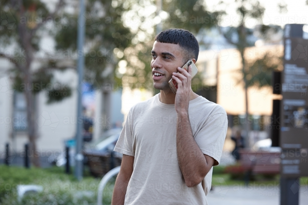 Young Indigenous Australian man enjoying time outdoors - Australian Stock Image