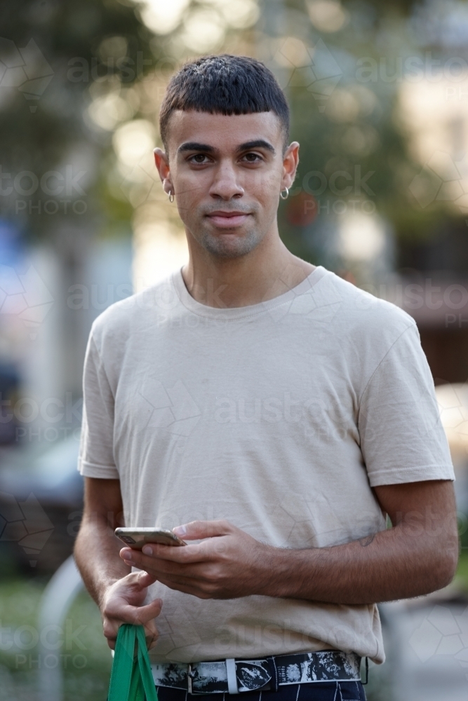 Young Indigenous Australian man enjoying time outdoors - Australian Stock Image