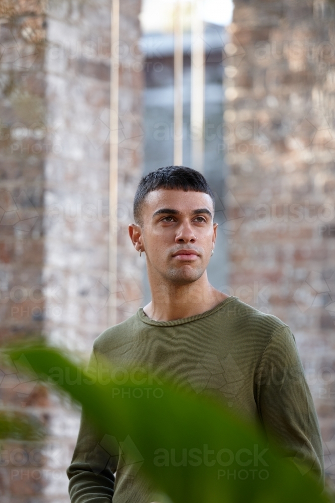 Young Indigenous Australian man enjoying time outdoors - Australian Stock Image