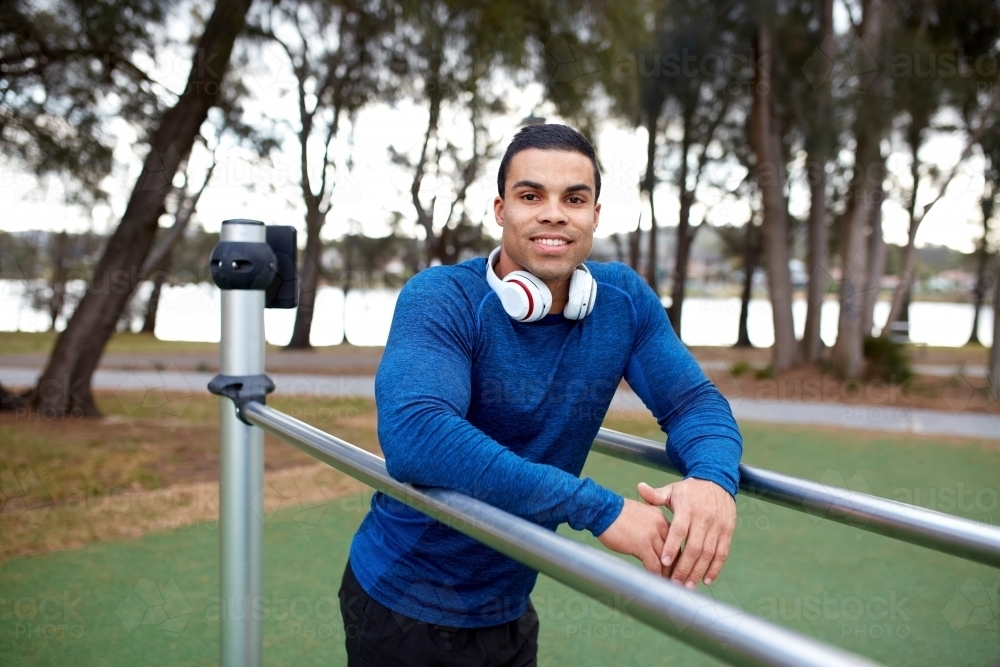 Young Indigenous man working out at park - Australian Stock Image