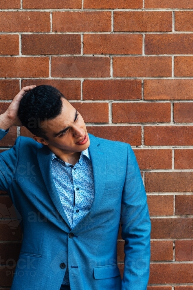 young man in suit, thinking - Australian Stock Image